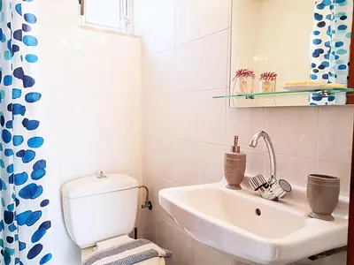 a bathroom with a toilet and a sink at Terra Falasarna in Falasarna