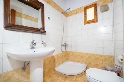 a bathroom with a sink and a toilet at 4-bedroom Topolia House in Topólia