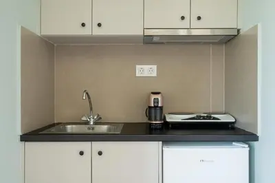 a small kitchen with a sink and a stove at Serenity Hideaway in Palaiochóra