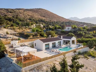 an aerial view of a house with a swimming pool at Villa White Harmony in Khámbatha