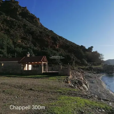 a house on a hill next to a river at Cormoranos Apartments Rooms Eco Green in Kissamos