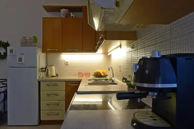 a kitchen with a sink and a mixer in it at Diamant's Place with Treehouse Garden in Kounoupidhianá