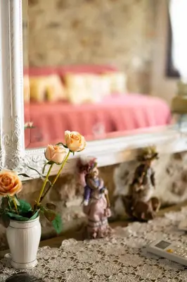 a vase with flowers in it sitting on a table at Agalide in Kissamos