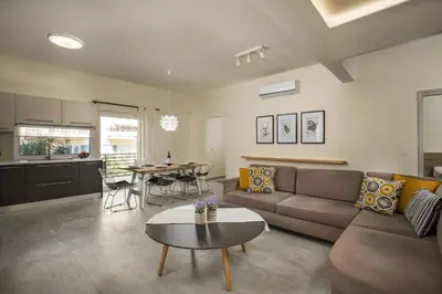 a living room with a couch and a table at Casa Di Xenia in Chania Town