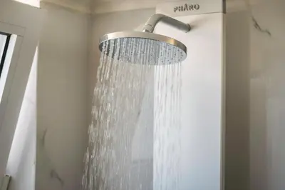 a shower with a shower head in a bathroom at Casa Di Xenia in Chania Town