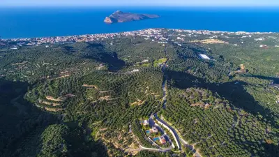 an aerial view of a mountain with the ocean at Meliades Villas in Agia Marina Nea Kydonias