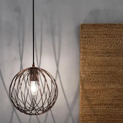 a metal light fixture hanging from a wall at The Mini Beach Hotel in Stalos