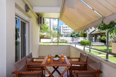 a table and chairs on the balcony of a building at Apartment A80 in Chania Town