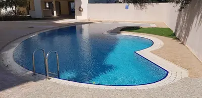 a swimming pool with blue water in a house at Apartment A80 in Chania Town