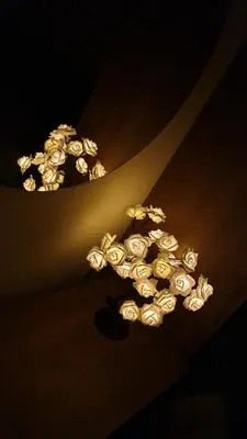 a bunch of white roses hanging from a ceiling at Enjoy Sunset in Palaiochóra