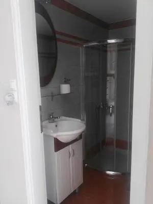 a bathroom with a sink and a shower at Baladinos Apartments in Gerani Chanion