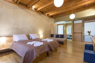 a bedroom with a bed with towels on it at Polixeny's Suites in Chania Town