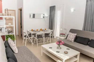 a living room with a couch and a table at Nikis Apartment in Chania Town