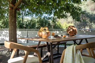 a wooden table with a bowl of food on it at Villa 7 in Perivólia