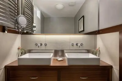 a bathroom with two sinks and a mirror at Villa 7 in Perivólia