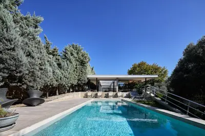 a swimming pool in a backyard with a gazebo at Villa 7 in Perivólia