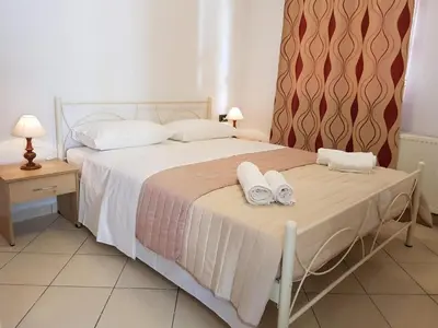 a bedroom with a bed with two towels on it at Ilia's Apt in Chania in Chania Town