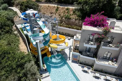 an aerial view of a water park with a water slide at Porto Platanias Village Resort in Plataniás