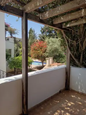 a view from the porch of a house with a white wall at Douliana Villas in Douliana