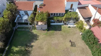 an aerial view of a house with a yard at Ismini Apartments in Kalyves