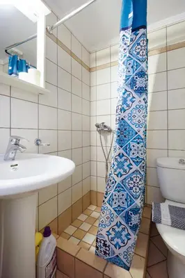 a bathroom with a sink and a toilet at Cozy Studio Chania in Chania Town