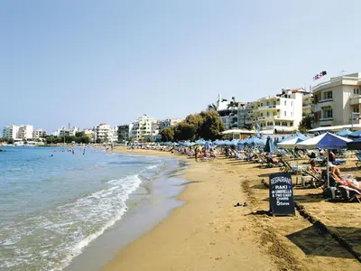 a beach with a lot of people and the ocean at Modern holiday home in Stalos with balcony in Stalos