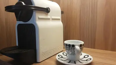 a coffee maker and a cup on a table at Armi Luxury Apartment in the Heart of the City in Chania Town