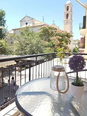 a glass jar sitting on a table on a balcony at Mare II - Studio in Old Harbor in Chania Town