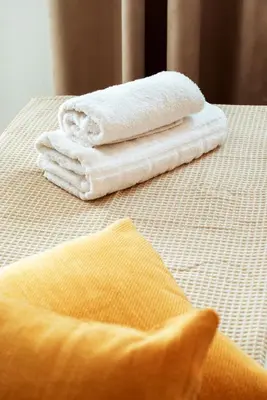 two towels sitting on top of a table at Mare II - Studio in Old Harbor in Chania Town