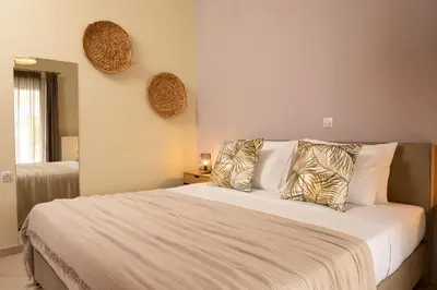 a bedroom with a large bed with two pillows at Amaen Apartment in Chania Town