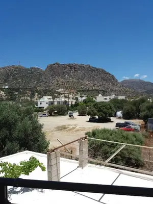 a view of a parking lot with mountains in the background at Oasis Studios in Palaiochóra