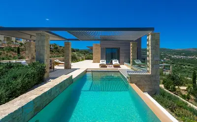 a swimming pool in the backyard of a house at Youphoria Sea View Villas in Kissamos