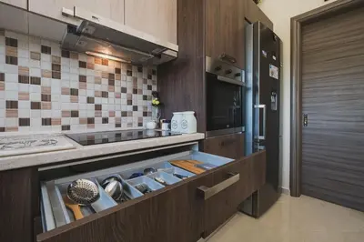 a kitchen with a stove and a counter top at Spacious Home with Parking in Chania Town