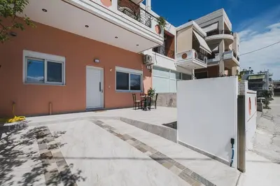 a house with a white board in front of it at Spacious Home with Parking in Chania Town