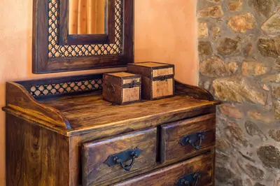 a painting of a wooden dresser with boxes on it at Villa Livadia with Pool, close to Elafonissi famous Beach in Livadia