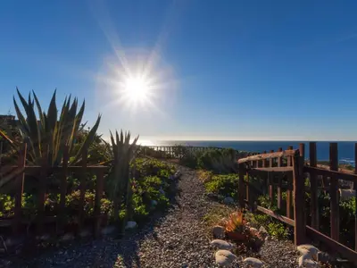 a garden with a fence and cacti at Villa Livadia with Pool, close to Elafonissi famous Beach in Livadia