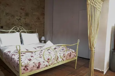 a bedroom with a bed with a laptop on it at Yro Studios in Chania Town