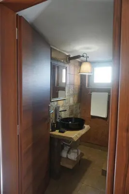 a bathroom with a sink and a mirror at Seas the view in Chania Town
