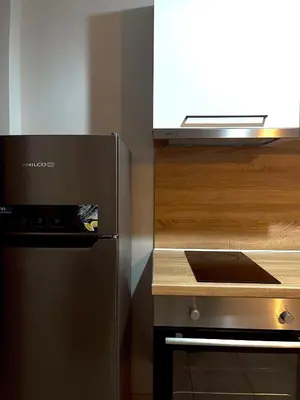 a kitchen with a counter with a microwave and a counter at Panos Village in Maláxa