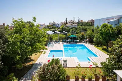 an overhead view of a swimming pool with trees and buildings at Villa Asteri in Kalamaki Chanion