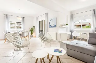 a living room with a couch and chairs at Marika's Guest House Chania in Chania Town