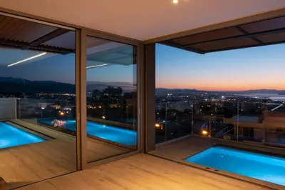 a view of the city from the balcony of a house at NV Illusion in Chania Town