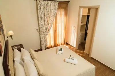 a living room with a couch and a table at Villa Anthira in Ropanianá