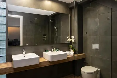 a bathroom with two sinks and a toilet at NV Two in Chania Town