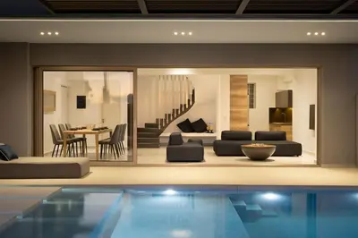 a living room with a swimming pool in a house at NV One in Chania Town
