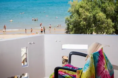 a balcony with a view of the beach at Mavros Molos Seaside Apartment in Kissamos