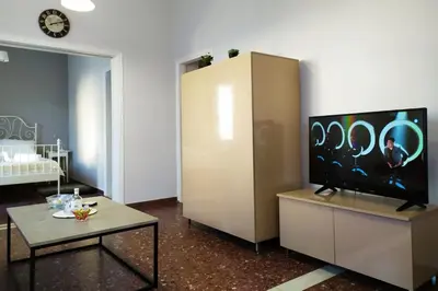 a living room with a tv and a table at Sunday Apartment Chania 2A in Chania Town