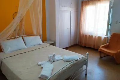 a bedroom with a bed with towels on it at Sunday Apartment Chania 2A in Chania Town