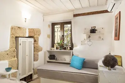 a room with a bed and a window at House Erofili in Chania Town