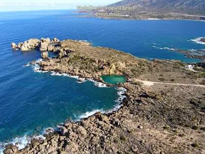 an aerial view of a rocky island in the ocean at Sea Lake Holiday House in Elafonisi